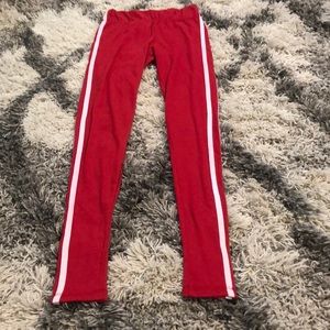 Red legging with white stripes on the side, size S